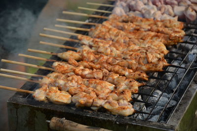 High angle view of meat on barbecue grill