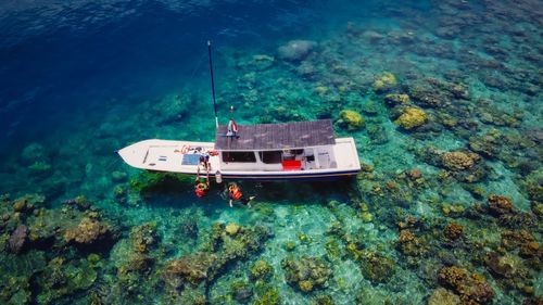 High angle view of ship sailing in sea