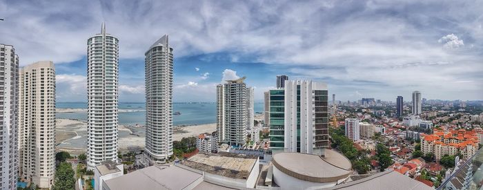 Modern buildings in city against sky