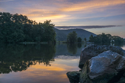 Scenic view of lake against sky during sunset