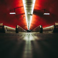 Empty illuminated underground walkway