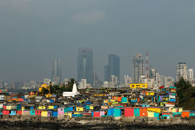 Panoramic shot of buildings against sky in city