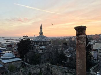Castle against sky during sunset in city
