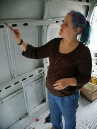 Young woman looking at home