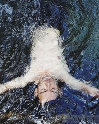 Portrait of man swimming in pool