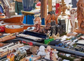 High angle view of figurines for sale at market stall