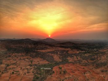 Scenic view of landscape against sky during sunset