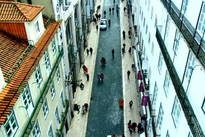 High angle view of people walking on city street