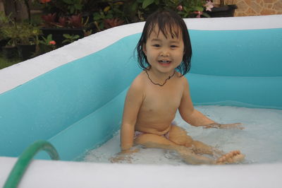 Portrait of smiling girl in swimming pool