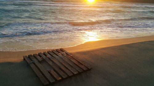 Scenic view of beach against sky during sunset