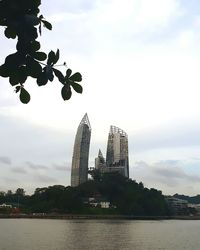 View of city against cloudy sky