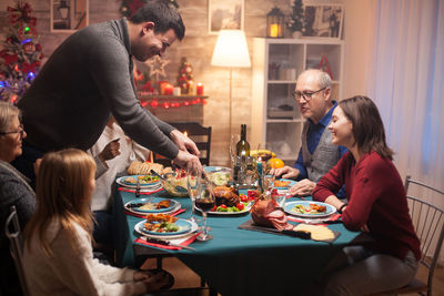 People sitting on table at home