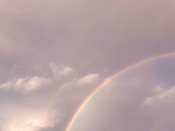 Low angle view of rainbow against sky