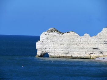 Scenic view of sea against clear blue sky