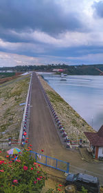 High angle view of bridge by road against sky