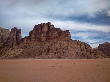 Rock formations in desert against sky