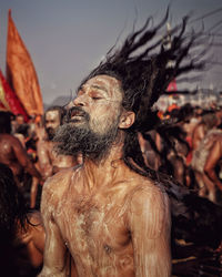 Close-up of sadhu against sky