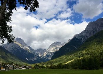 Scenic view of mountains against cloudy sky