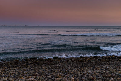 Scenic view of sea against sky at sunset