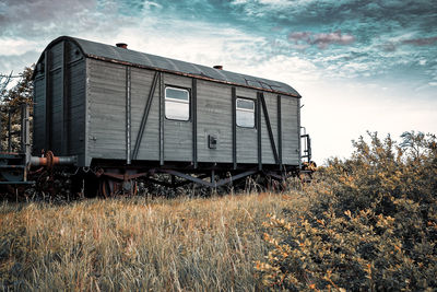 Train on field against sky