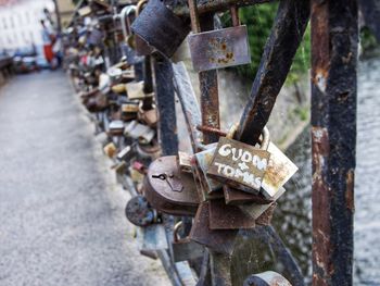 Close-up of padlocks hanging on railing