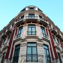 Low angle view of building against clear blue sky