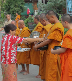 Children standing in traditional clothing