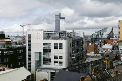 Modern buildings in city against sky