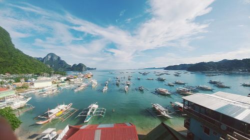 High angle view of boats moored on sea against sky