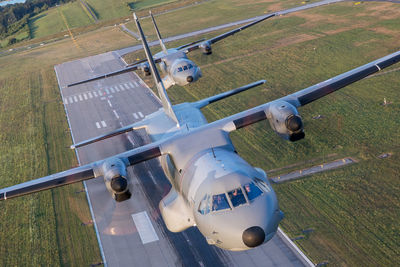 High angle view of airplane on airport runway