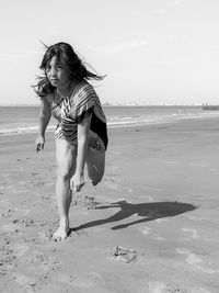 Woman standing on beach