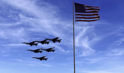 Low angle view of flag against sky