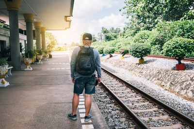 Full length of man walking on railroad track