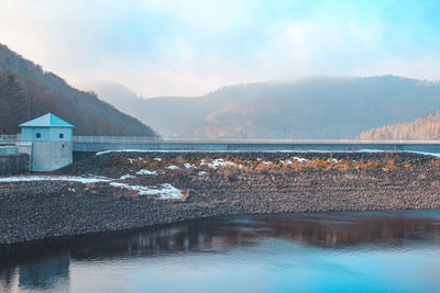 Bridge over river against sky