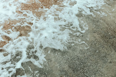 High angle view of bubbles on beach