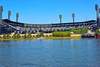 View of bridge over river against buildings