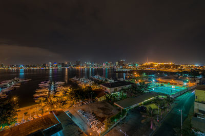 High angle view of illuminated buildings in city at night