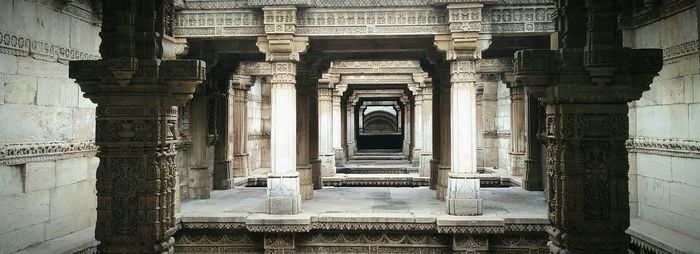 Empty long pathway along pillars