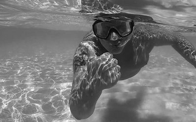 Portrait of man swimming in sea