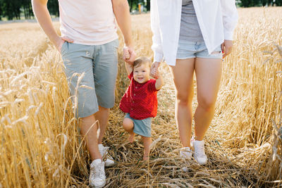 Healthy mother, father and little son enjoy nature together in the fresh air. a happy family 