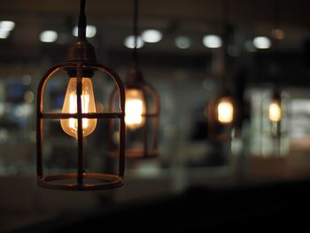 Close-up of illuminated light bulbs at night