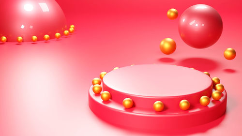 Close-up of balloons against pink background