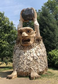 Statue against trees and plants