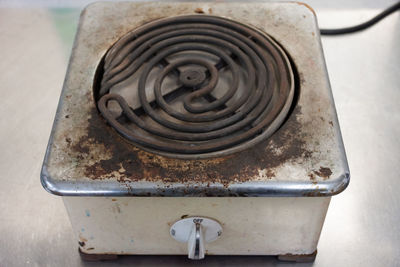 High angle view of rusty metal on table at home