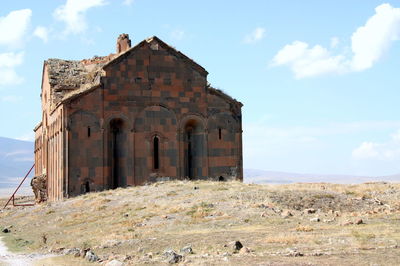 Old ruins of temple against cloudy sky