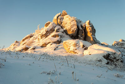 Scenic view of snowcapped mountain against clear blue sky