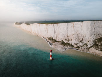 Aerial scenic photo of beachy head lighthouse and seven sisters cliffs in eastbourne united kingdom.