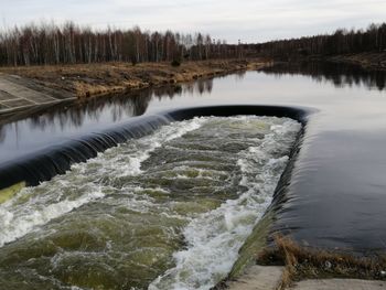 Scenic view of river flowing amidst trees decnogorck