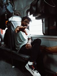 Low angle view of woman sitting in car