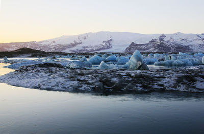 Scenic view of frozen sea against sky